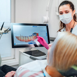 dentist reivewing scan with patient