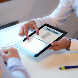 dentist reivewing dental scan insurance information on tablet